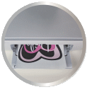 A pink and black doormat with a heart design, placed in front of a table or workspace.