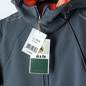 Application image price tag for labeling merchandise on a rain jacket.