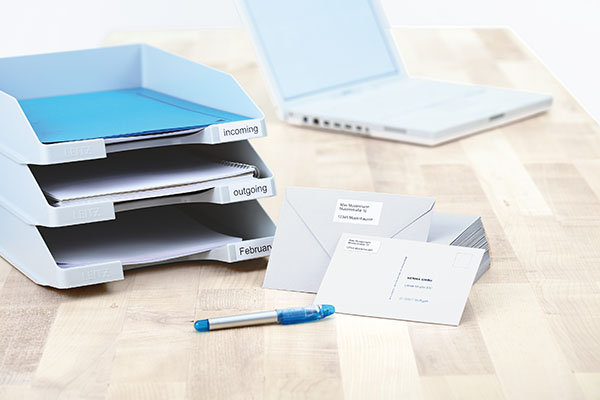 Sender labels and shipping instructions on envelopes and organizational systems.