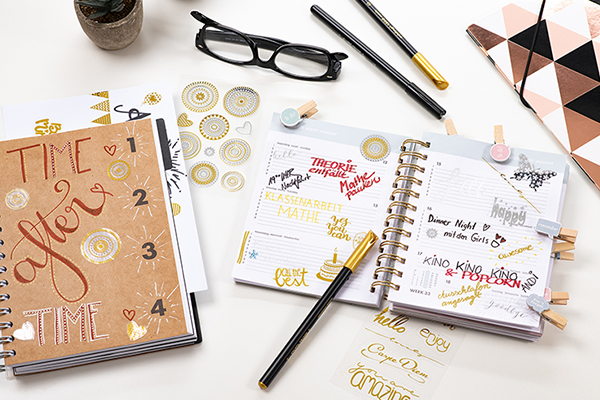 Creative stickers in various colors sticking in a notebook.