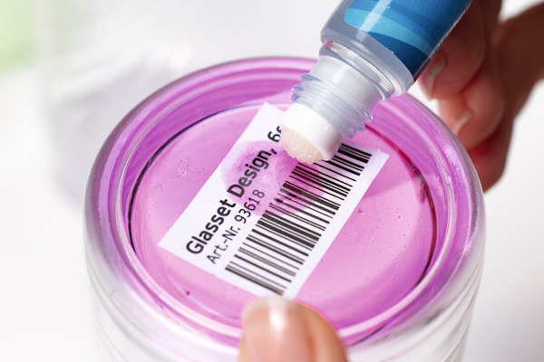 Glass with a price tag that can be removed with a label remover.