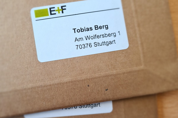 Natural brown envelope with a printed label made from recycled material.