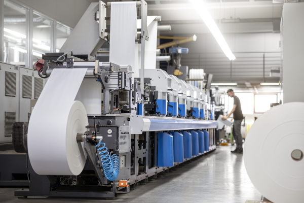 The translation of "Haftmaterial Maschine" is "Adhesive Material Machine.