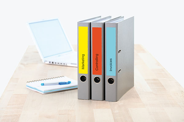 Image of text labels with years on a binder