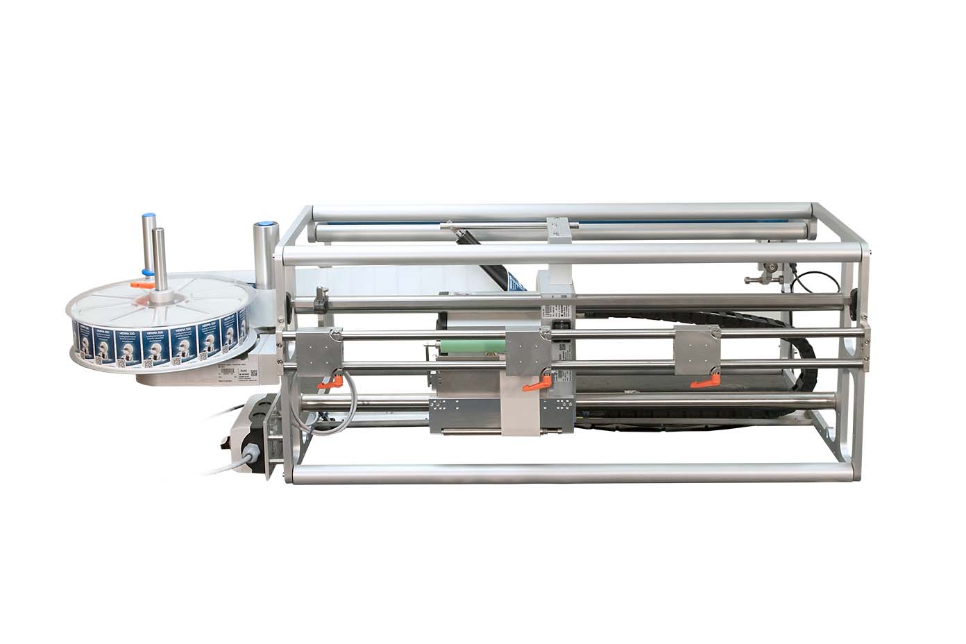 A mechanical device with a round container and a frame, designed for automated processes in the industry.