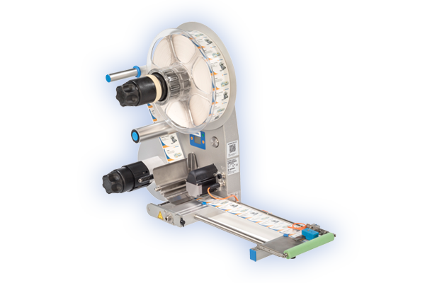Labelling machine with roll holder that applies labels to a conveyor belt surface.