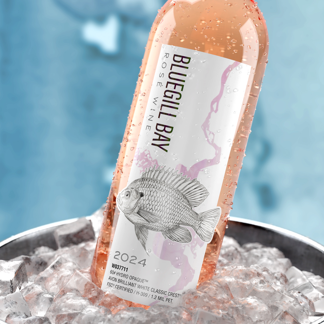 Bottle of Bluegill Bay Ros wine in an ice bucket, featuring a fish design on the label and the year 2024.