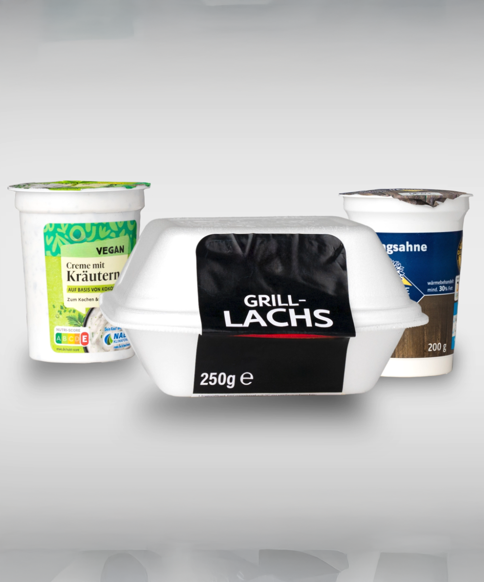 Three packages of food: a vegan herb cream, a whipped cream, and a package of grilled salmon (250g).
