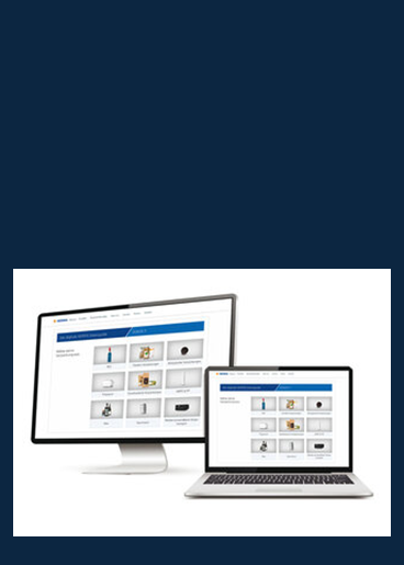 Two computer screens, one large and one small, display a user interface featuring various product images and categories.