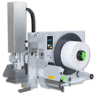 Labelling machine with a large roll holder, control panel, and a printing mechanism for labels.