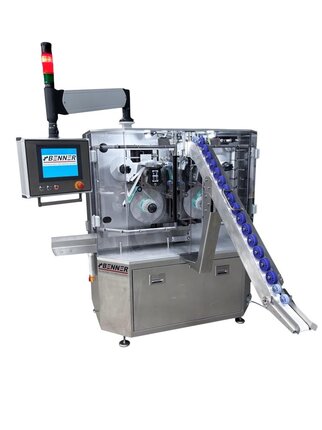 Automatic packaging machine with two rollers, a conveyor belt, and a control panel for operation.