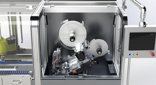 Automated machine with two spools and a control panel, designed for the processing or packaging of materials.