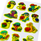 Colorful stickers of snails engaged in various activities, including listening to music, playing, and cooking, wearing sunglasses and hats.