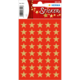 Rote Sticker mit goldenen Sternen auf einem Bogen, ideal für Dekoration oder Bastelprojekte.