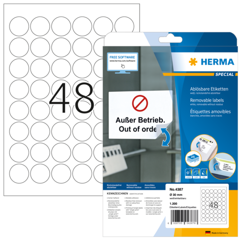 Ein Blatt mit ablösbaren Etiketten, nummeriert mit 48, und eine Verpackung mit der Aufschrift "Außer Betrieb. Out of order."
