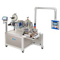 Automatic labelling machine with a control panel and various mechanical components for labelling products.