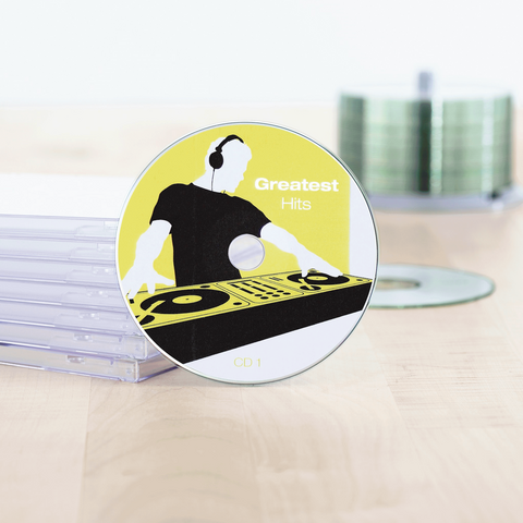 CD titled 'Greatest Hits,' displayed on a table, surrounded by empty CD cases.