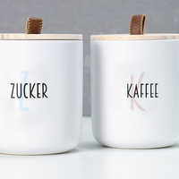 Storage containers labeled with round, transparent stickers.