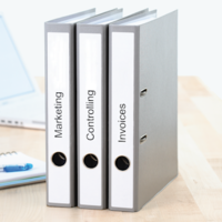 Binders labeled with printed binder labels.