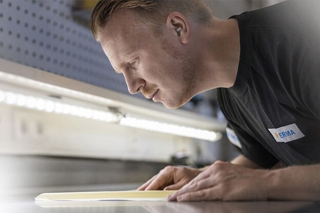 Employee in label inspection