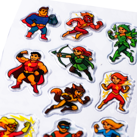 Colorful stickers featuring various superhero characters, including a hero with a shield, an archer, and a flying figure.