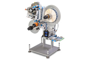 A labelling machine with multiple rollers that applies labels to products. It features various mechanical components and a sturdy base.