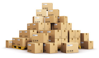 A stack of boxes on a pallet, arranged in various heights and sizes. The boxes are labelled.