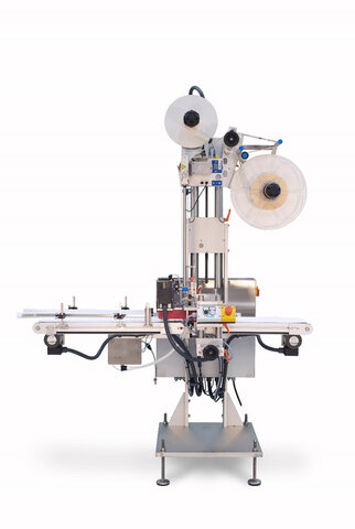 A labelling machine with two rollers, a conveyor belt, and various controls for applying labels to products.