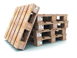 Wooden pallets, one stacked and one leaning, with visible markings and labels on the sides.