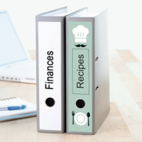 Binders labeled with printed binder labels.