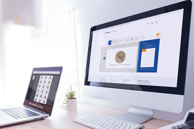 Two computer monitors on a desk, one displaying a user interface, the other showcasing a collection of coins.