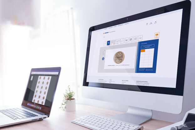 Two computer monitors on a desk, one displaying a user interface, the other showcasing a collection of coins.