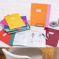 Desk with notebooks and HERMA binder covers