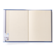 Ein offenes Notizbuch mit leeren Seiten und einem Aufkleber auf der linken Seite.