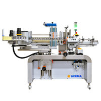 Automatic labelling machine from HERMA, equipped with multiple stations for labelling bottles or containers.