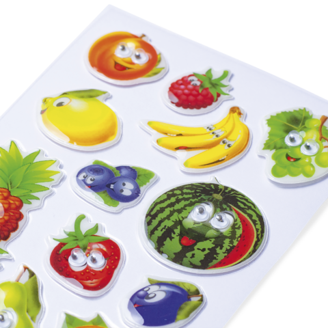 Bunte Aufkleber von verschiedenen Früchten mit Augen, darunter Äpfel, Bananen, Erdbeeren und Wassermelonen.
