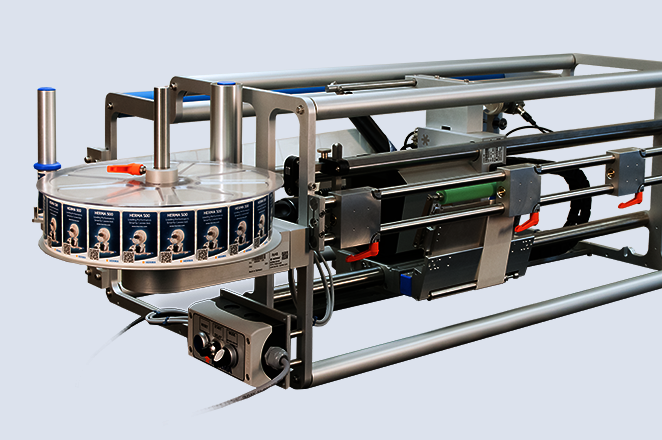An industrial machine with a circular conveyor system and a engine, designed for automated production processes.