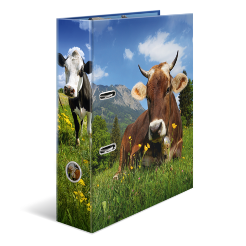 A folder with a picture of two cows in a meadow, surrounded by flowers and mountains in the background.