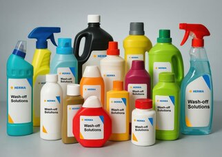 Various bottles of cleaning agents and solutions, labelled with 'Wash-off Solutions' and the HERMA logo.