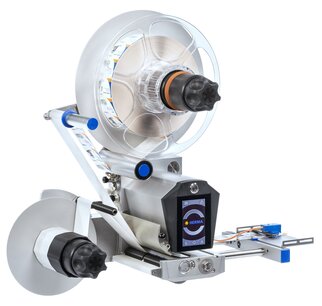 Labelling machine with a large roll, a control display, and precise mechanics for applying labels to products.