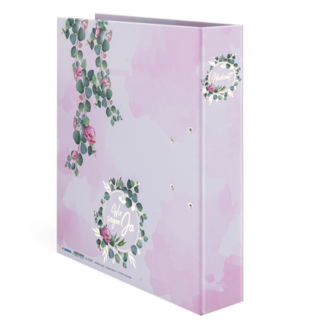 Ein rosa Ordner mit floralen Motiven und dem Text "Wir sagen Ja" auf der Vorderseite.